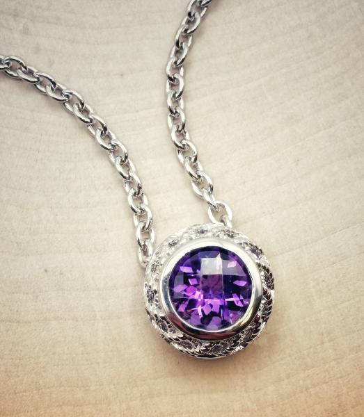 Sterling silver and round checkboard cut amethyst necklace. $225.00