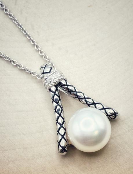 Sterling silver button freshwater cultured pearl and diamond necklace. $325.00