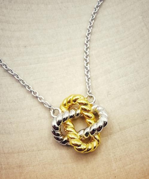 Sterling silver and 18 karat vermeil rope style knot earrings. $170.00