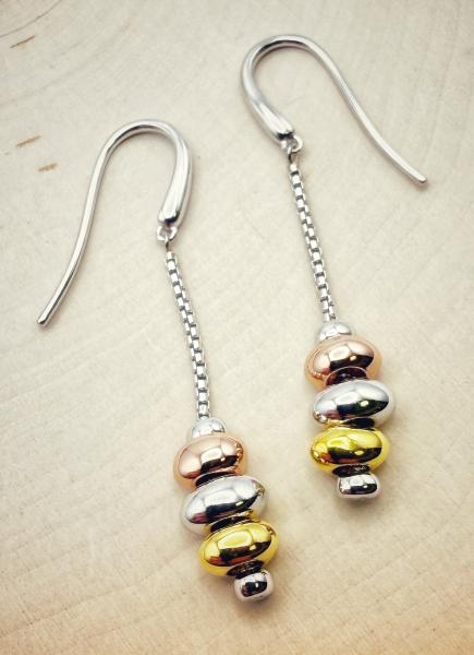Sterling silver and 18 karat tricolor gold vermeil pebble dangle earrings. $160.00