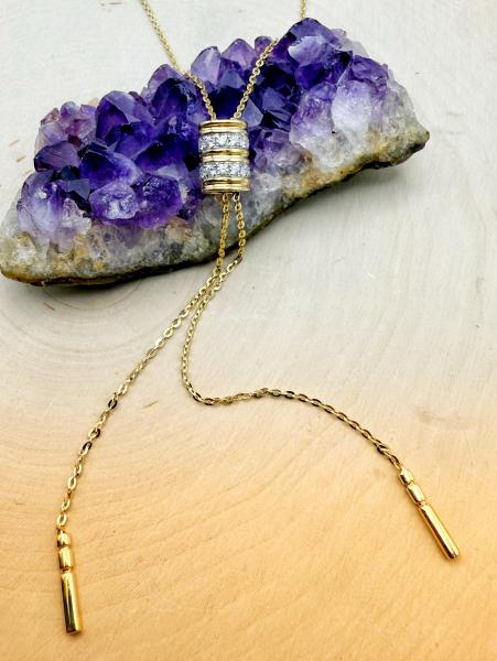 32" 14 karat yellow gold adjustable diamond slide necklace. $2,950.00