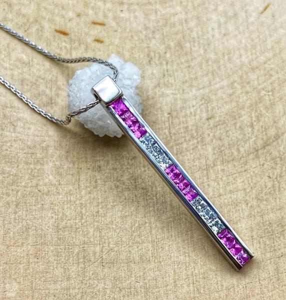 18 karat white gold pink sapphire and diamond bar necklace. 550-13600