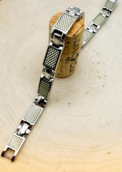 Stainless steel and carbon fiber bracelet. $150.00
