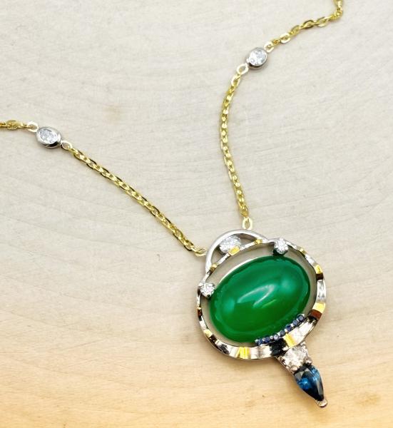 18 karat white and yellow gold 5.18 carat oval cab chalcedony, blue sapphire and diamond necklace. $3150.00