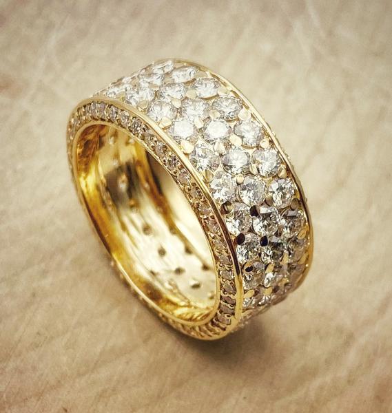 14 karat yellow gold pave eternity ring. 168 lab grown diamonds totaling 5.64 carats. 124-11101