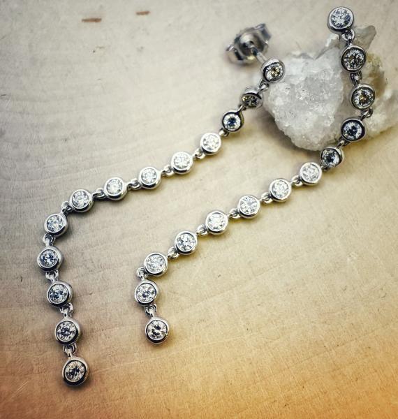 14 karat white gold long dangle lab grown diamond earrings totaling 0.58 carat. $1205.00