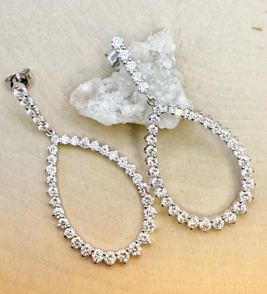 14 karat white gold long tear drop  earrings with lab grown diamonds totaling 3.00 carats. $2800.00