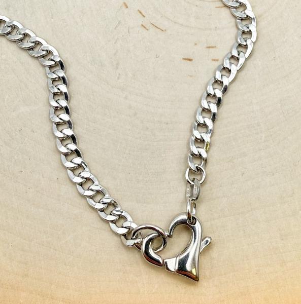 Sterling silver curb link heart clasp necklace. $185.00
