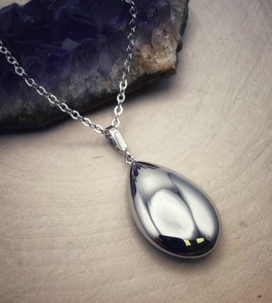 Sterling silver puffed tear drop necklace. $130.00