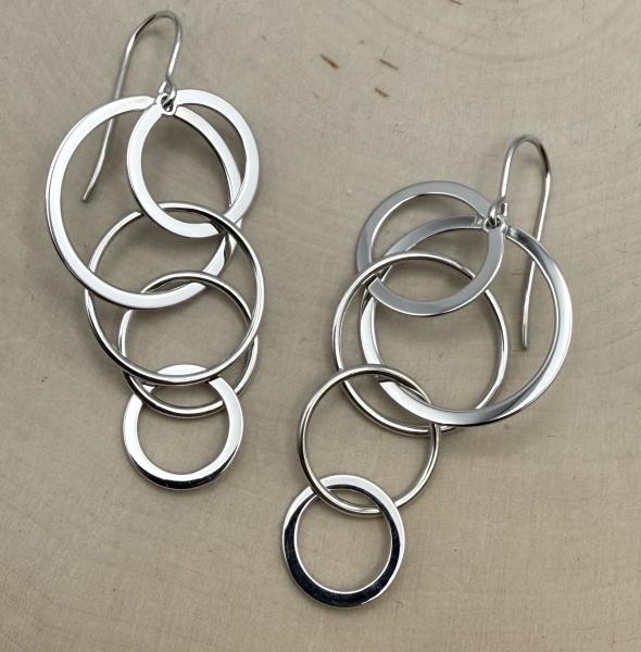 Sterling silver dangle circles earrings. $225.00