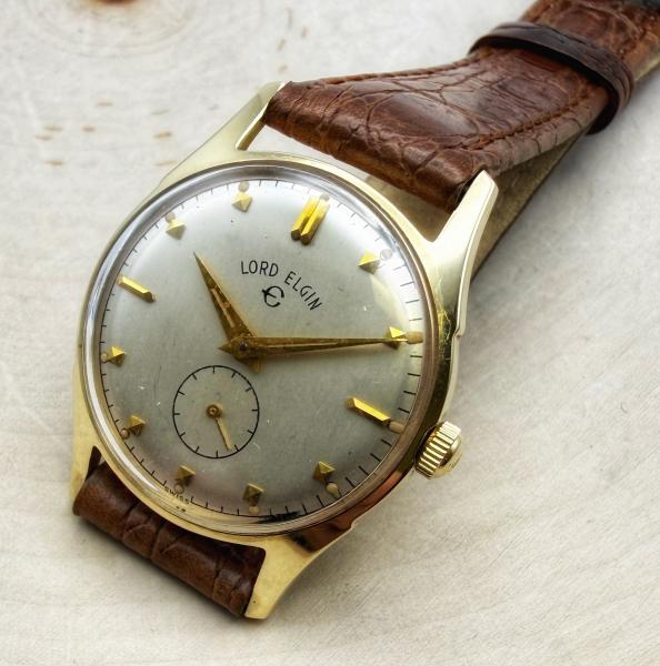 14 karat yellow gold Lord Elgin gents wristwatch. 21 jewels, 29mm case. Circa 1950's. $875.00