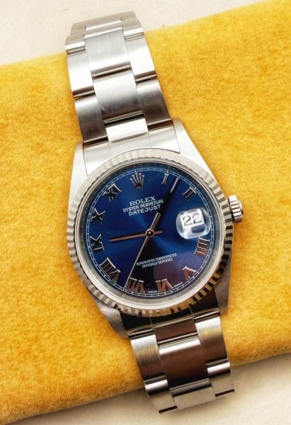 Gents Rolex Oyster Perpetual 36mm Datejust. Stainless steel Oyster band with an 18 karat white gold fluted bezel. Circa 2000. $7,995.00