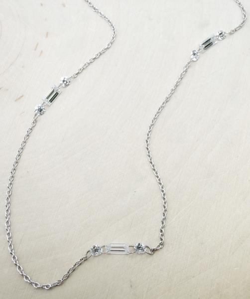 14 karat white gold "floating" diamond necklace with baguette and round lab grown diamonds totaling 1.05 carat. $2250.00