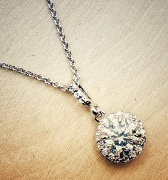14 karat white gold lab grown diamond halo necklace. $1490.00