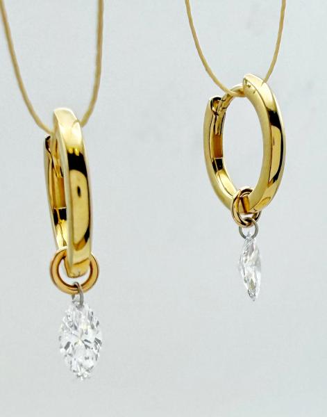 14 karat yellow gold "floating" diamond earrings with two marquise cut lab diamonds totaling 0.62 carat. $1395.00