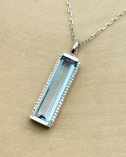 14 karat white gold 3.89 carat baguette cut Swiss blue topaz and diamond necklace. $2000.00
