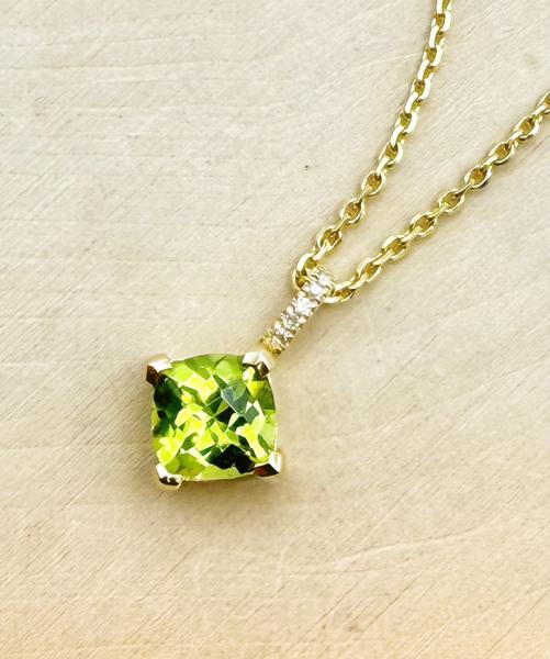 14 karat yellow gold cushion checkerboard cut peridot and diamond necklace. $995.00