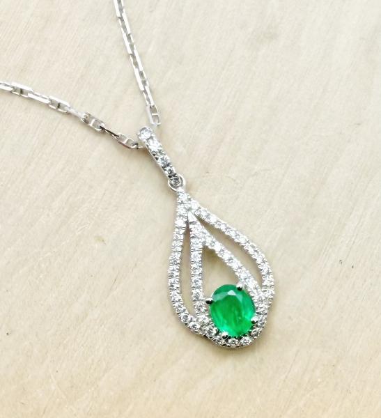 14 karat white gold emerald and diamond necklace. $2970.00