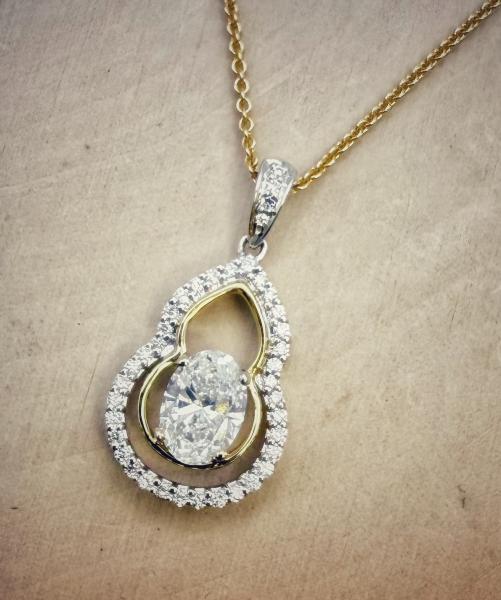 18 karat yellow and white gold diamond necklace totaling 0.98 carat. $$2670.00