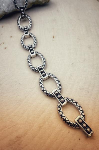 Sterling silver oval link bracelet. $385.00