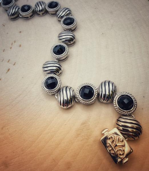 Sterling silver and faceted black onyx bracelet. $440.00