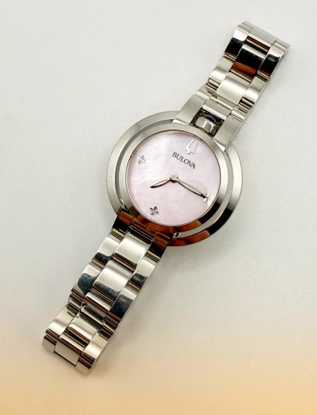 Ladies stainless steel Bulova with a pink mother of pearl dial. $575.00