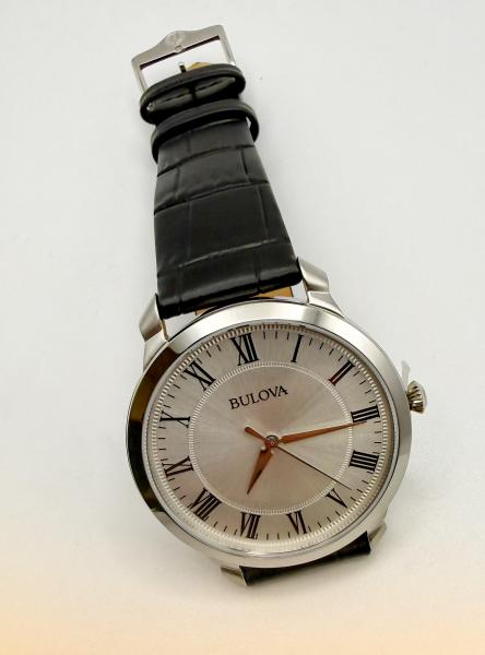 Gentlemen's Bulova quartz with a stainless steel case, silver dial and black Roman numerals. $295.00