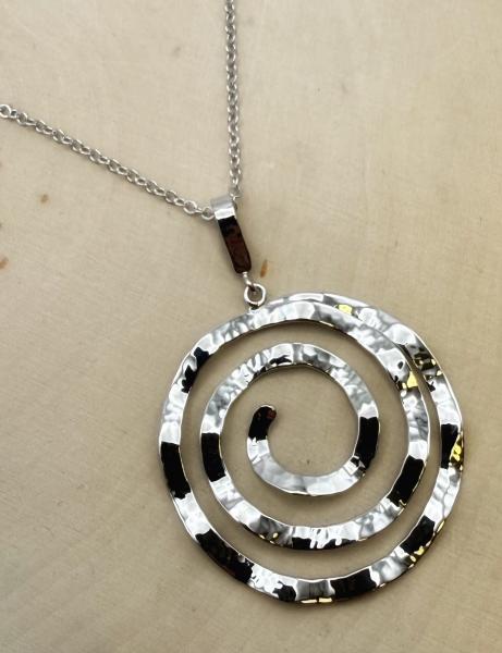 Sterling silver hammered spiral necklace. $190.00