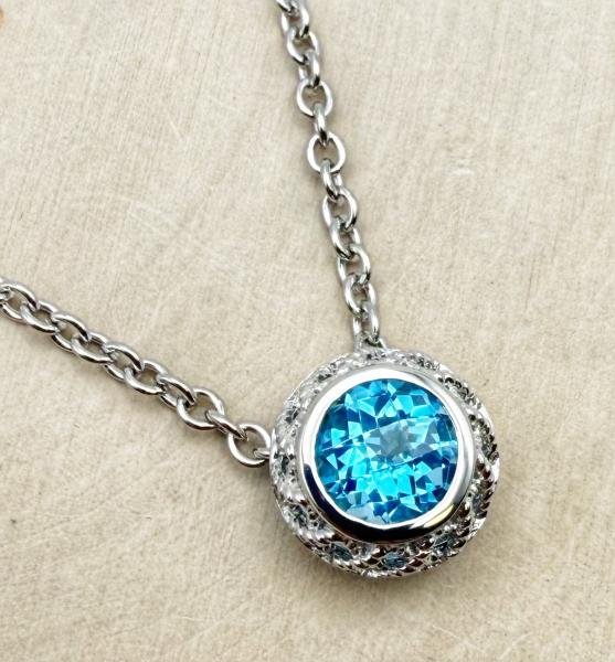 Sterling silver and checkerboard cut Swiss blue topaz necklace. $350.00