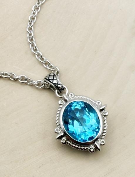 Sterling silver and oval faceted Swiss blue topaz necklace. $400.00