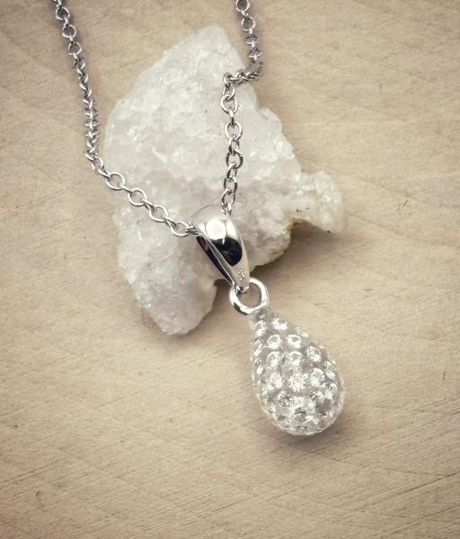 The Solare diamond teardrop. Diamonds set in clear carbon composite. $1205.00