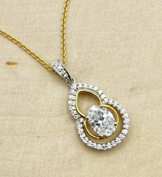 18 karat yellow and white gold custom designed diamond necklace totaling1.08 carats. $2670.00