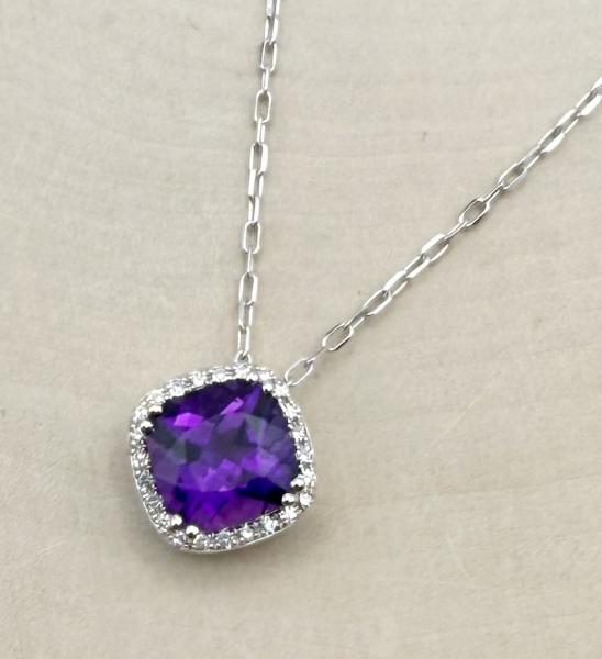 14 karat white gold cushion cut amethyst and diamond halo necklace. $1480.00
