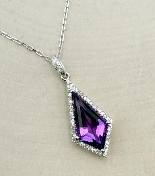 14 karat white gold Kite shape faceted amethyst and diamond necklace. $2025.00