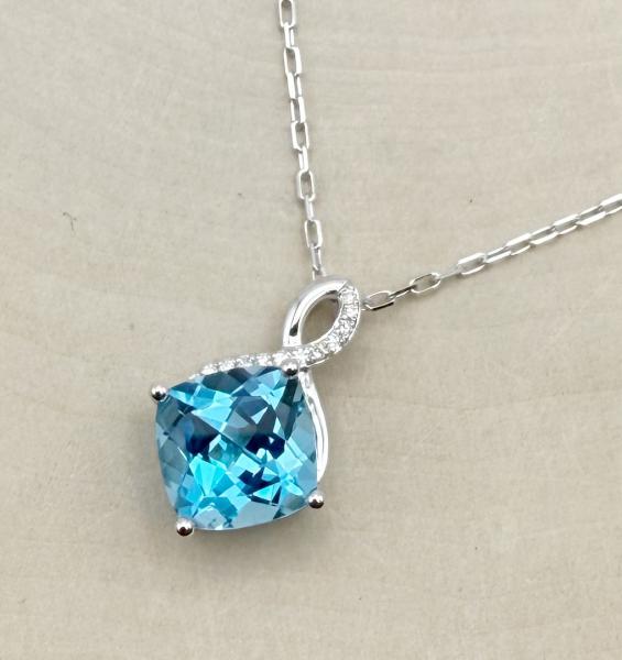 14 karat white gold cushion Swiss blue topaz and diamond necklace. $1560.00