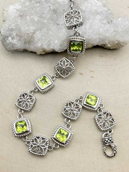 Sterling silver and checkerboard cushion cut peridot bracelet. $700.00