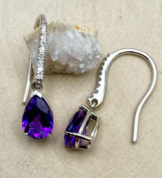 18 karat white gold pear shape amethyst and diamond dangle earrings. $1695.00