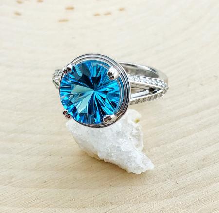 4.50 carat custom cut Swiss blue topaz with 40 brilliant cut lab grown diamonds. *sold*