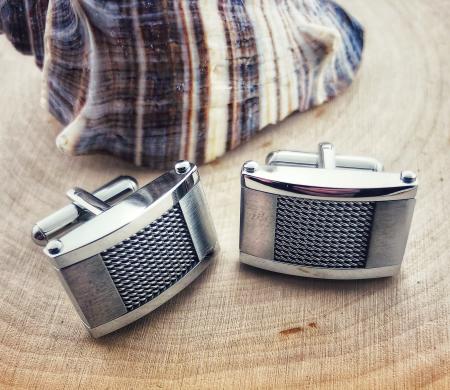 Stainless steel cuff links with a braided wire design. $65.00