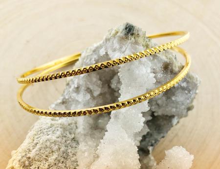 22 karat yellow gold diamond cut design bangles.  $760.00 each