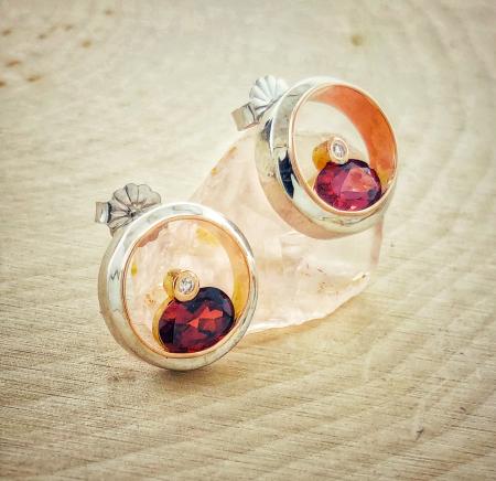 18 karat white and rose gold, garnet and diamond earrings. Designed by Rick Little. $825.00