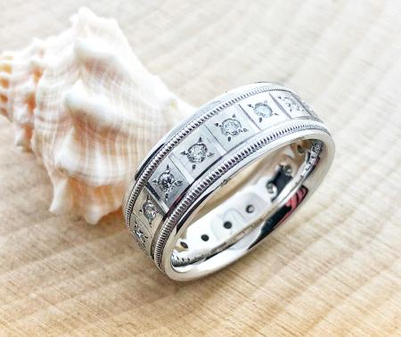 14 karat white gold eternity ring with 18 brilliant cut diamonds. $2300.00