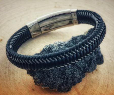 woven black leather and stainless steel bracelet. $65.00