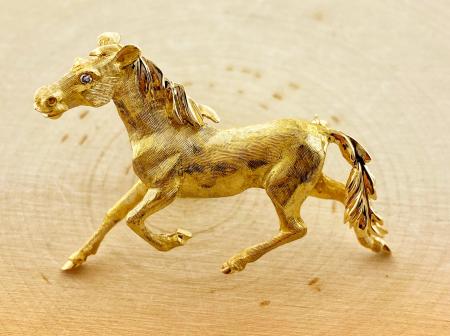 14 karat yellow gold, hand engraved, horse brooch. $2250.00