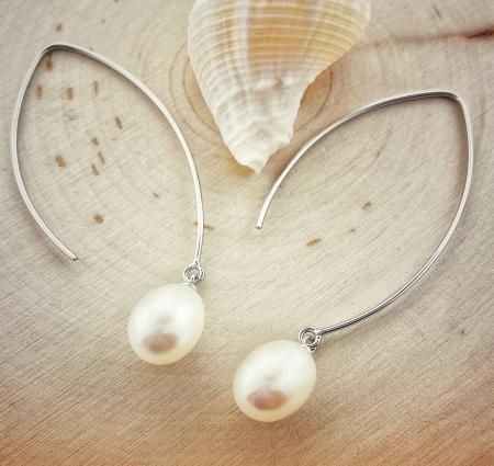 Sterling silver dangle earrings with a 9-10mm cultured freshwater pearl. $170.00