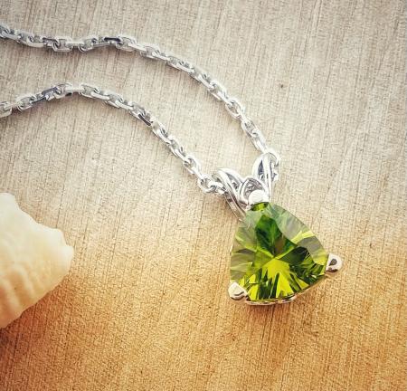 14 karat white gold trillion cut peridot necklace. $627.00