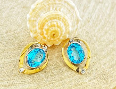 18 karat yellow and white gold Swiss blue topaz and diamond earrings. $750.00