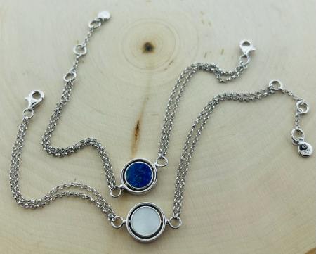 Sterling silver "Eclipse" reversible lapis & mother of pearl spinner bracelet. $230.00. One currently available.