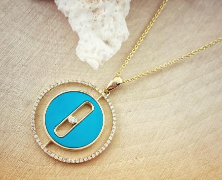 14 karat yellow gold turquoise and diamond pendant on chain. $1430.00