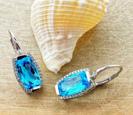 14 karat white gold earrings with cushion cut Swiss blue topaz and diamonds. $1225.00